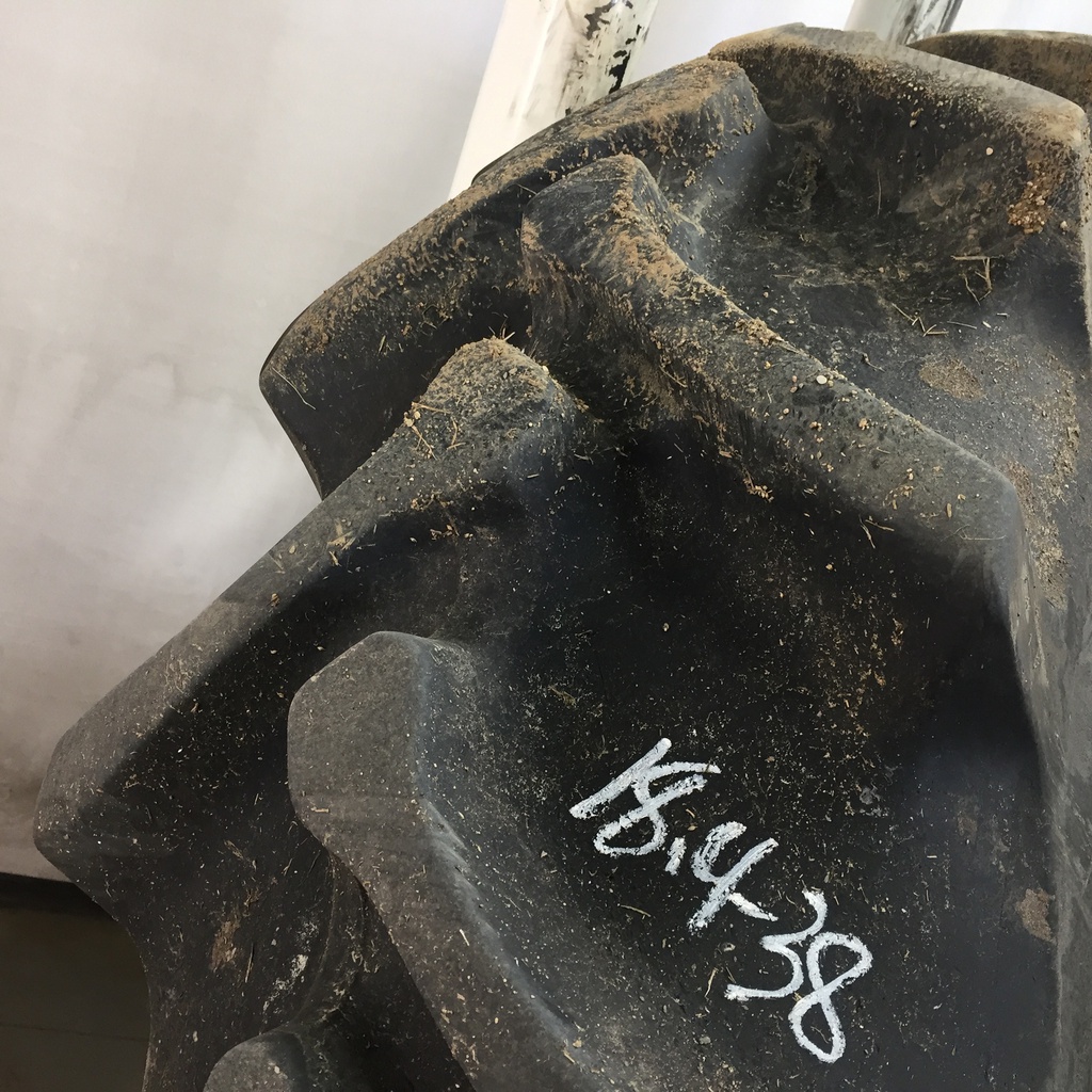 18.4/-38 Firestone Champion Spade Grip R-2 on John Deere Yellow 10-Hole Dolly Dual 80%