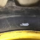 18.4/-38 Firestone Champion Spade Grip R-2 on John Deere Yellow 10-Hole Dolly Dual 80%
