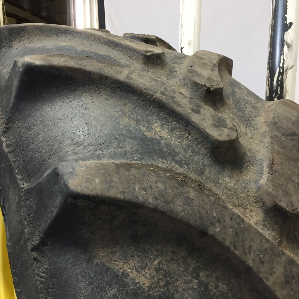 710/70R38 Firestone Radial All Traction DT R-1W on John Deere Yellow 10-Hole Formed Plate W/Weight Holes 45%