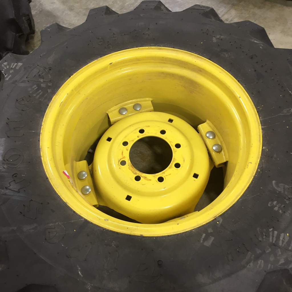 16.9/-24 Firestone All Traction Utility R-4 on John Deere Yellow 8-Hole Rim with Clamp/U-Clamp (groups of 2 bolts) 99%