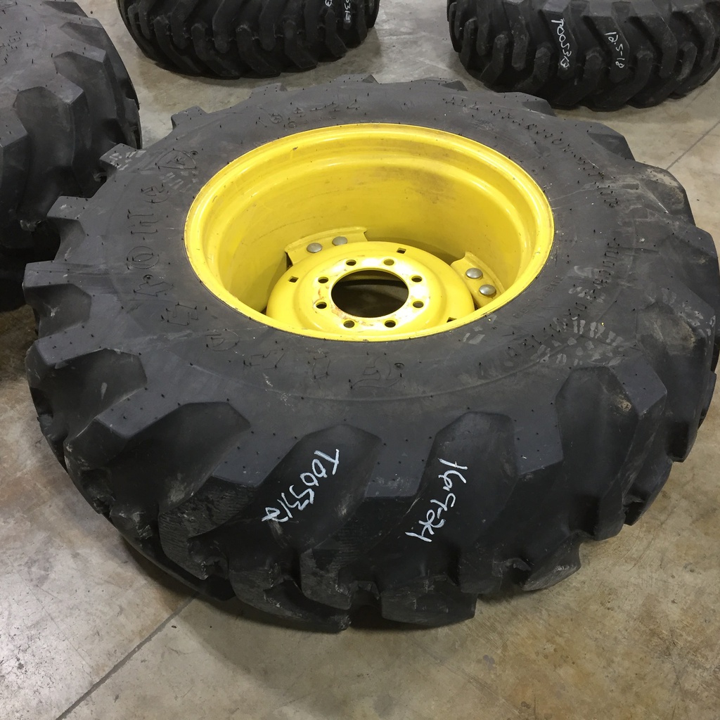 16.9/-24 Firestone All Traction Utility R-4 on John Deere Yellow 8-Hole Rim with Clamp/U-Clamp (groups of 2 bolts) 99%